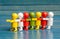 Group of people together, in a row, different colored figurines, business team strategy and teamwork abstract symbol