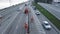 A group of people in uniform is cleaning the street, the carriageway and the highway. Municipal workers clean the road in the city