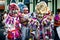 Group of people in varied pied costumes pose for photo at dominican carnival