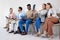 Group of people, waiting room and interview at job recruitment agency with laptop, tablet and resume. Human resources