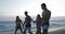 Group Of People Walking On Beach At Sunset, Two Mix Race Couple Communication During Summer Vacation