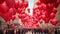 A group of people is walking down a street that is filled with red balloons, A festive Valentine\\\'s parade filled with heart