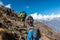 Group of People walking up on steep Mountain Trail