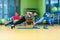 Group of people working out in a gym with a dumbbell