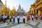 A group of people working together as a team to sweep the floor in Shwedagon Pagoda