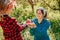 A group of people working together to gather fresh apples in a lovely orchard