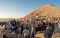 A group of photographers at the top of Nemrut Mountai near Commagene statue ruins waiting for sunset in Adiyaman, Turkey
