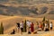 Group of photographers waiting for a golden hour to photograph iconic summer landscape of Toscana.