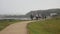 A group of pilgrims walks quickly along the Portuguese path