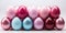 A group of pink and blue eggs sitting on top of each other