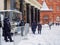 A group of police officers are on duty at the metro during a heavy snowfall