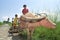 Group portrait of boys riding on a water buffalo