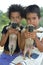 Group portrait Brazilian children with puppies