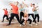 Group portrait of fine teenagers in dance studio