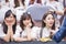 A group portrait photo of Thai girl idol group called Sweat16! with soft focus on the middle girl.
