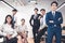 Group portrait of smiling diverse young businesspeople posing together in modern office