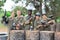 Group portrait of team of paintball players with marker guns