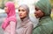 Group Portrait Of Three Multiracial Islamic Women Wearing Hijab Outside
