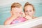 Group portrait of white Caucasian mother and child daughter playing in water diving in swimming pool