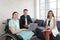 Group portrait of young Asian disabled working woman with her colleagues, businessman and businesswoman