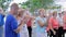 Group of positive older people clapping, applauding at sporting event