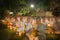 Group of practitioners meditation sitting meditate with candle in Mahabodhi temple ,Bodh Gaya ,Bihar at night