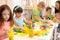 Group of preschool children engaged in handcrafts