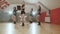 A group of pretty women dancing modern dance in studio