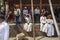 A group of priests have rest on footstep of temple , Dasain Festival , Kathmandu , Nepal