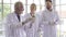 Group of professor researcher scientist with white gown prepare testing chemical liquid with science equipment on desk. With face
