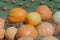 Group of pumpkins sitting on straw.