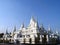group of pure white pagoda at wat asokaram with clear bright blue sky