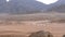 Group on Quad Bike Rides through the Desert in Egypt on backdrop of Mountains. Driving ATVs.