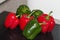 Group Of Red,Green Peppers Just Washed On Chopping Board