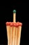 Group of red wooden matches with green match