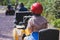 Group of riders riding ATV vehicle crossing forest rural road, process of driving rental vehicle, all terrain quad bike vehicle,