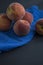 Group of ripe peaches. Dark background