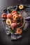 A group a ripe peaches in rustic bowl