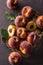 A group a ripe peaches in rustic bowl