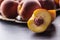 A group a ripe peaches in rustic bowl