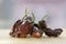 Group of ripened capsicum chinenses very hot peppers on wooden table, Habanero chocolate