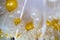 A group of rising helium balloons in white and gold color on a ceiling of an apartment