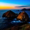 a group of rocks in the water