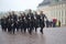 The group of royal guardsmen marching in the rain. A guard divorce ceremony fragment at the Royal palace. Stockholm