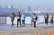 A group of runners of different ages run in the winter city during the Christmas half-marathon