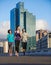 Group runs are great. three young joggers out for a run in the city streets.