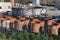 Group of Rusty Industrial Cylindrical Containers Grouped Outdoors