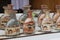 Group of sand bottles with pictures of camels in desert.