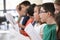 Group Of School Children Singing In Choir Together