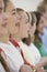 Group Of School Children Singing In Choir Together